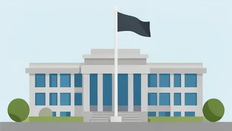 A modern government building with a large flagpole in front