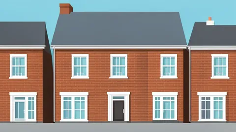A row of terraced houses with brick facades and sash windows