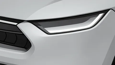 A row of modern electric SUVs parked in a lot