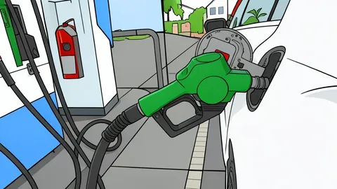 A fuel pump nozzle resting on a concrete forecourt