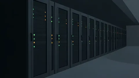 A row of industrial server racks with blinking status lights in a dark data center