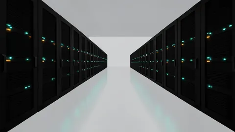 Rows of black server racks with glowing status lights inside a large, air-conditioned data center hall