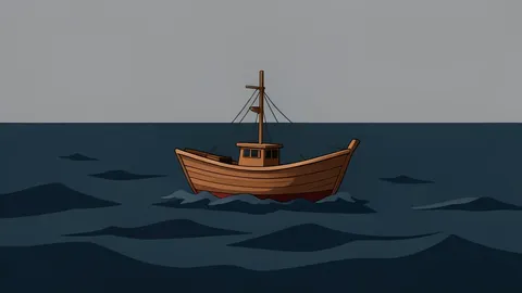 A small wooden fishing boat floating on dark, choppy ocean water under a grey sky