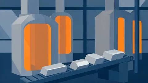 Industrial vacuum induction melting furnaces and metal alloy ingots in a factory setting