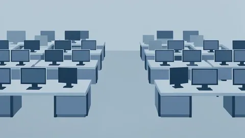 A modern trading floor with rows of empty desks and monitors