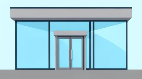 A modern bank branch facade with large glass windows and a metal entrance