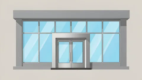 A modern bank branch facade with large glass windows and a metal entrance