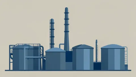 A large industrial oil refinery complex with tall distillation towers and storage tanks
