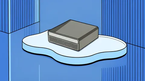A compact silver computer chassis with a fully ventilated front panel