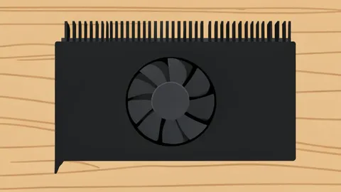 A black graphics card with a large cooling fan and metal heatsink fins resting on a wooden desk