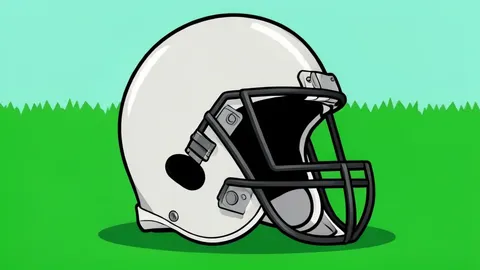 A football helmet resting on a green turf field