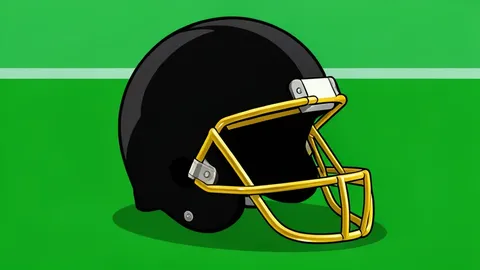 A football helmet resting on a green turf field