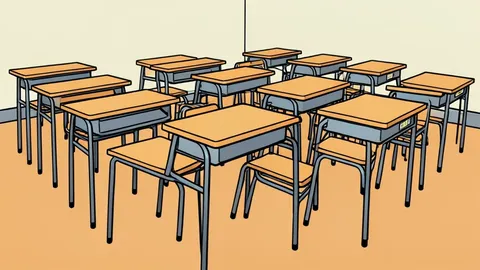 A row of empty school desks in a classroom