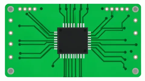 A green printed circuit board with a black square microchip in the center