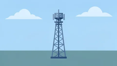 A telecommunications cell tower standing in a field