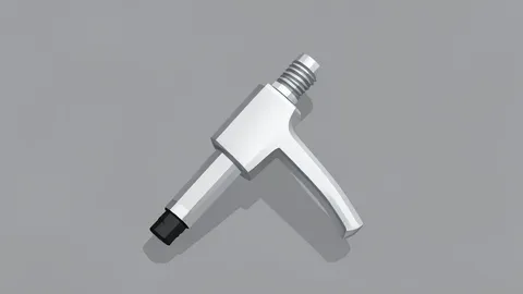 A fuel pump nozzle resting on a concrete forecourt