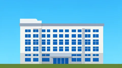 A large, multi-story office building with a flat roof and rows of uniform windows, standing alone against a clear sky.