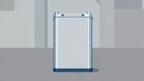 A large industrial battery cell standing upright on a factory floor
