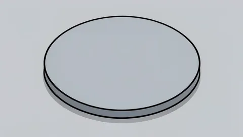 A flat vector illustration of a silicon wafer resting on a cleanroom surface.