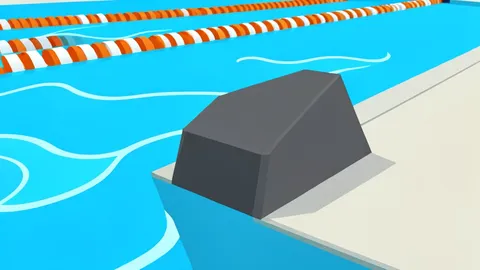 A competitive swimming pool with lane ropes and starting blocks