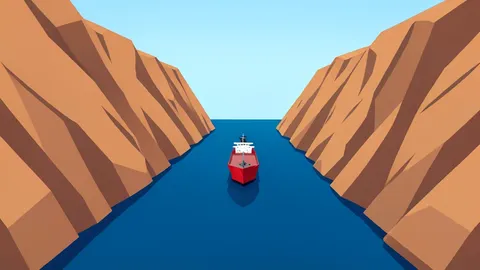 A narrow, deep-water strait flanked by steep, arid cliffs with a single oil tanker navigating the channel