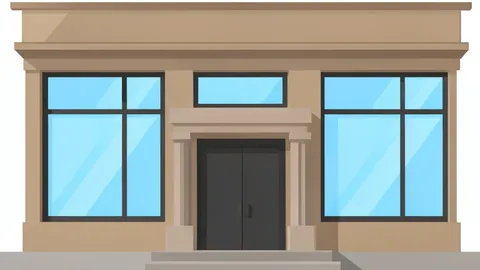 A traditional bank branch facade with large glass windows and a heavy stone entrance