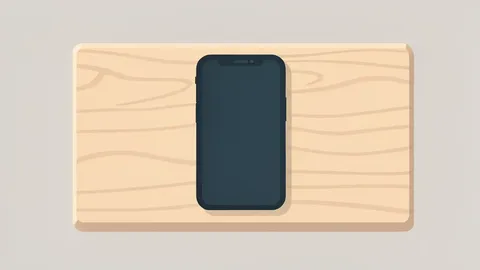A smartphone resting on a wooden school desk