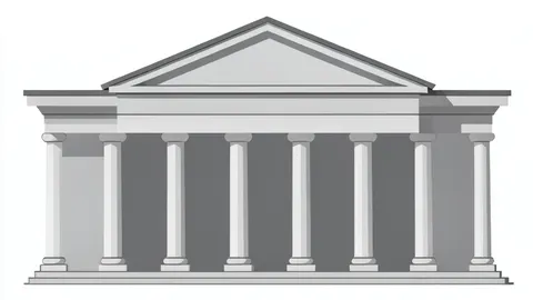 A neoclassical stone building with a colonnade of columns and a triangular pediment