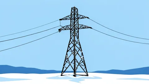 A damaged high-voltage electricity pylon standing isolated in a snowy field