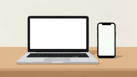 A modern laptop and smartphone sitting side-by-side on a clean desk surface