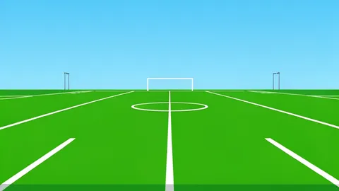 A green football field with white yard lines and goalposts in the distance