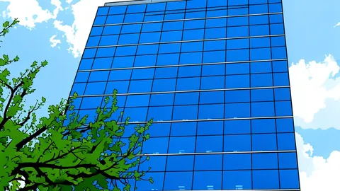 A modern office building with a glass facade and a large entrance lobby