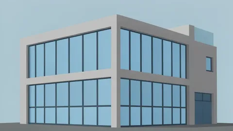 A modern commercial office building exterior with large glass windows and a concrete facade