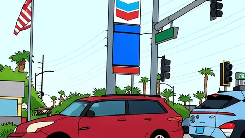 A fuel pump nozzle resting on a concrete forecourt