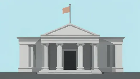 A modern central bank facade featuring large stone columns and a flagpole against a clear sky.