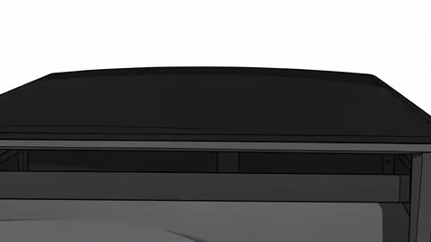 A black fabric truck bed cover stretched over the rear of a pickup truck