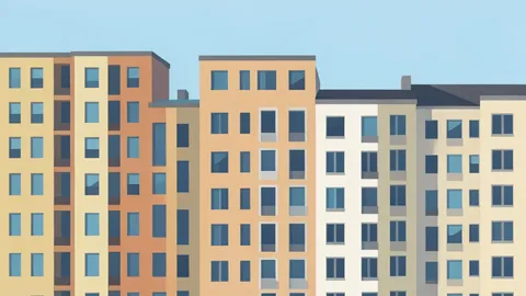 A row of multi-story apartment buildings in a dense urban neighborhood