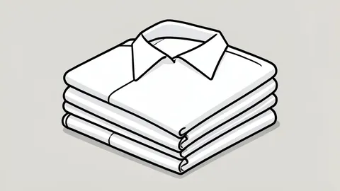 A neat stack of folded white work uniforms