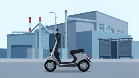 An electric scooter parked in front of a large industrial manufacturing facility with visible assembly lines and battery storage units.