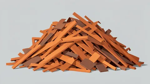 A pile of shredded copper wire and scrap metal in an industrial recycling facility.