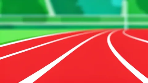 A red running track with white lane markings curving around a stadium