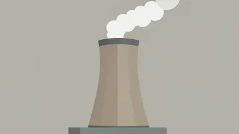 A large industrial cooling tower with steam rising from the top