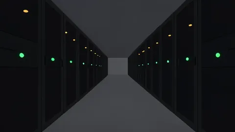 Rows of black server racks with blinking status lights in a dimly lit data center aisle