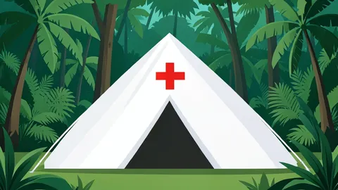 A white medical tent with a red cross symbol situated in a dense green tropical forest.