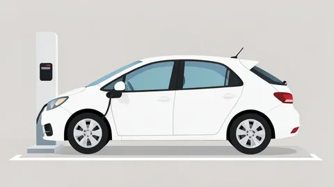 A white electric vehicle plugged into a charging station in a parking lot