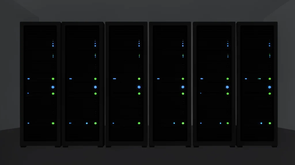 A row of black server racks with blinking status lights in a dimly lit data center