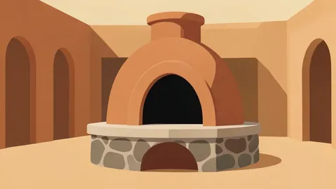 A traditional clay communal oven with a dark, arched opening and a stone base, situated in a dusty courtyard.