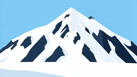 A vast, snow-covered mountain landscape in a polar region with exposed dark rock faces