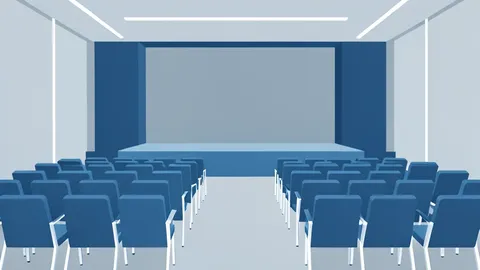 A modern conference hall with rows of empty chairs facing a stage