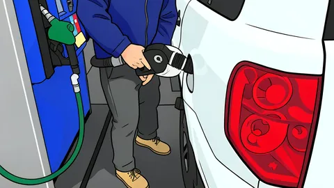 A fuel pump nozzle resting in its holster at a service station